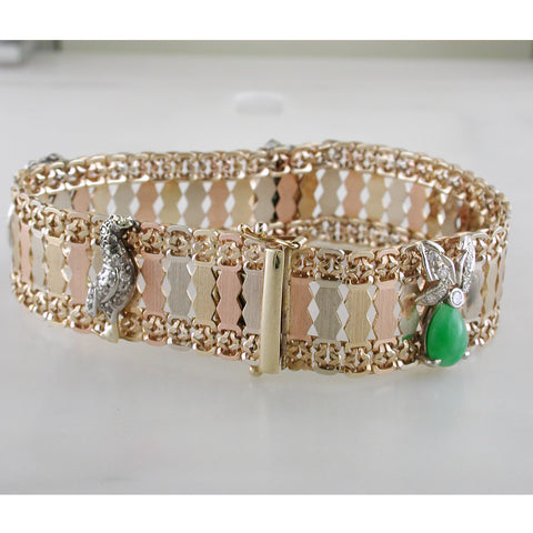 All of our estate items are completely inspected, cleaned, and polished by our master jeweler to insure you are buying a heirloom which will be wearable the moment it arrives. This is a certified pre-owned and antique item, and some wear is to be expected and is characteristic.         18K Yellow Gold & Sterling Silver .925     1.5" wide     2.25" wide center opening     Weighs 45.34 grams     High polish finish     Hand engraved designs     Hallmarked Barnaby Sterling 18K 87106  Call (203) 989-4122 or emai